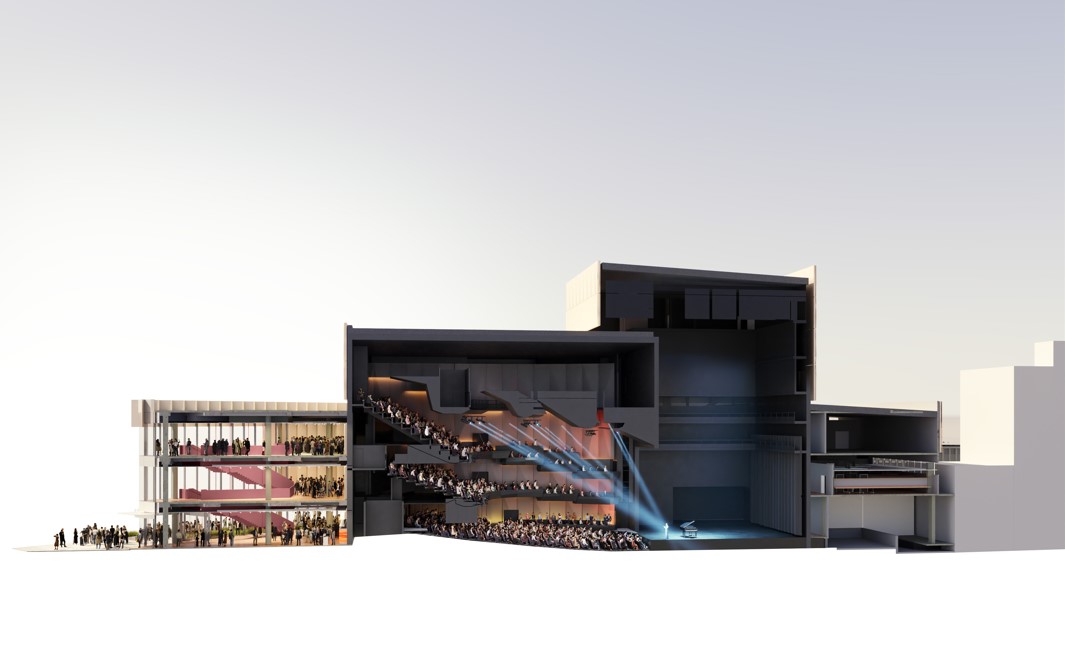 Image shows the inside of the venue from a distance, from foyer areas, auditorium, stage and flytower system