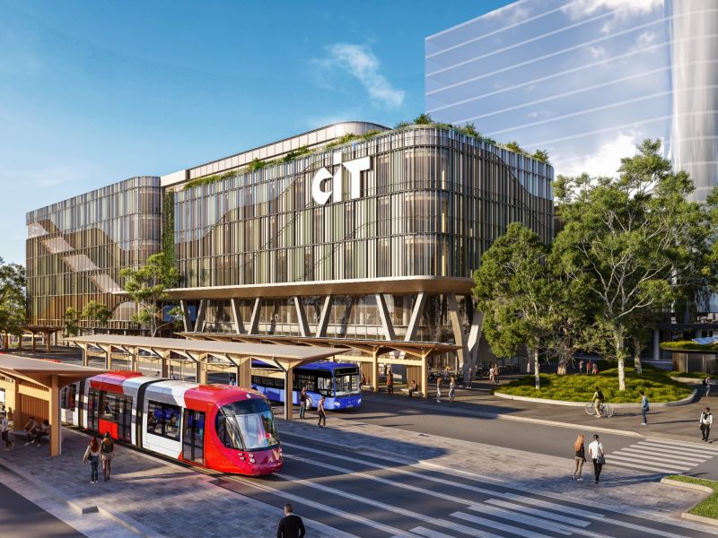 External view of main CIT building with light rail vehicle buses in the foreground.